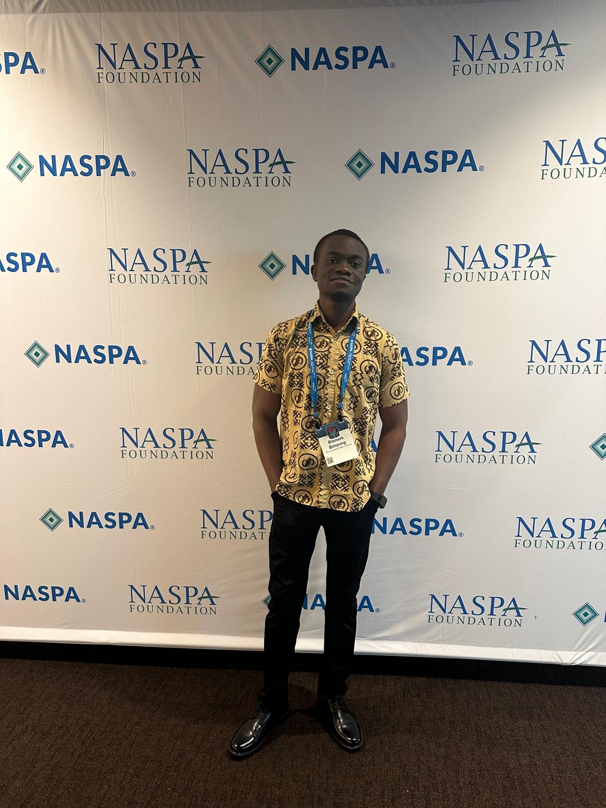 Bismark at the NASPA Foundation backdrop